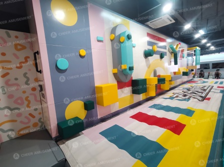 Indoor playground project in China with multi-level play structure and slides